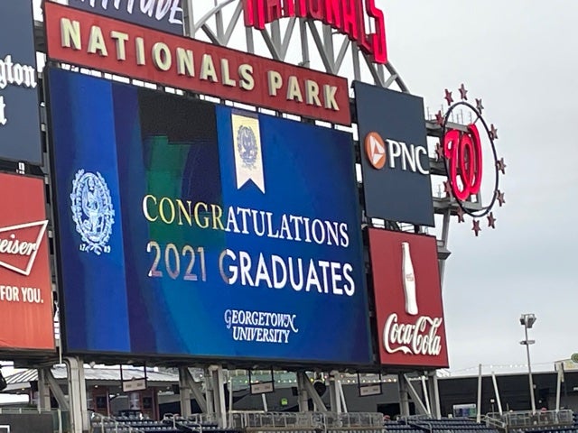 The Nationals Park screen displays a message of congratulations to 2021 Georgetown University graduates