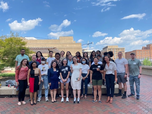Students, faculty and staff pose together on the Podium in Fall 2021