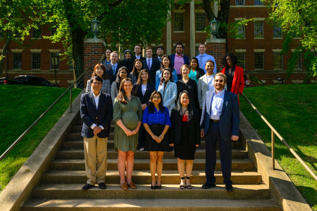 Students and faculty pose together in front of the Medical and Dental Building in Spring 2022