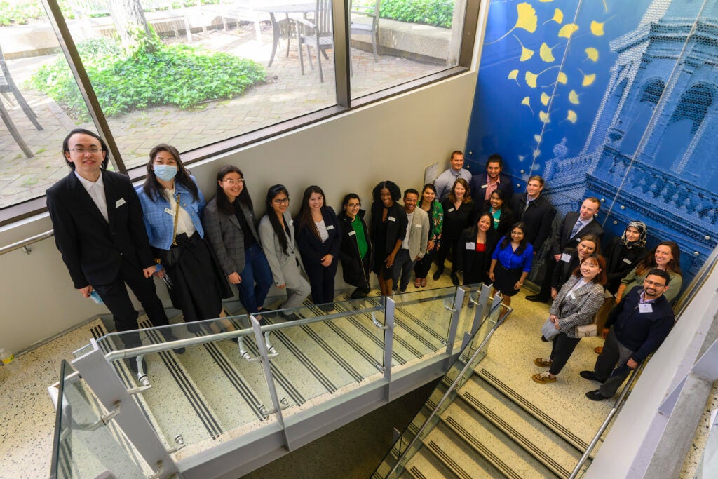 Students pose together in the Preclinical Building in Spring 2022