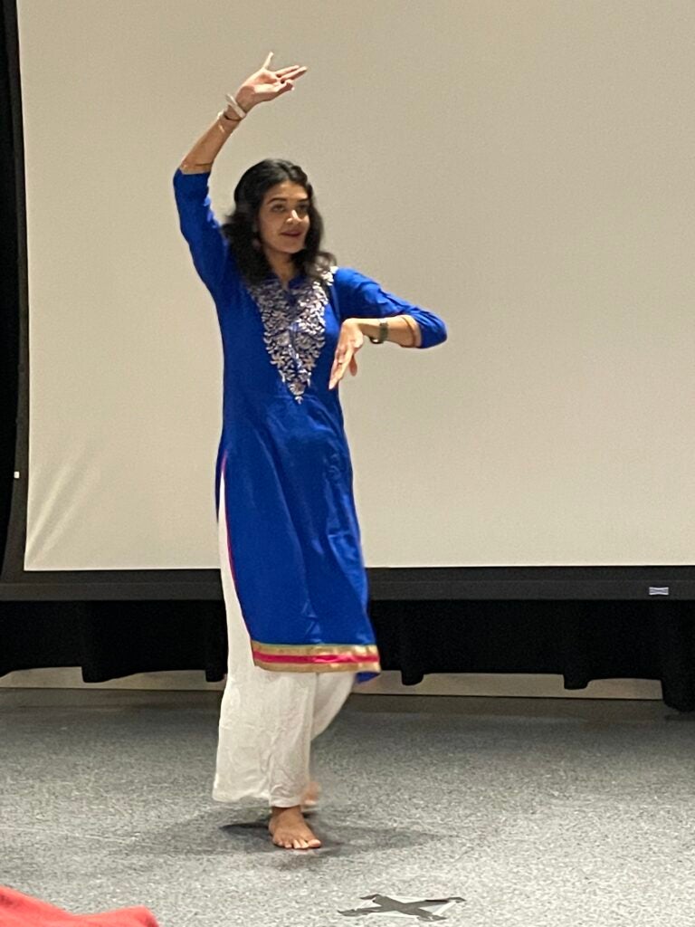 A student performs at Diwali 2022