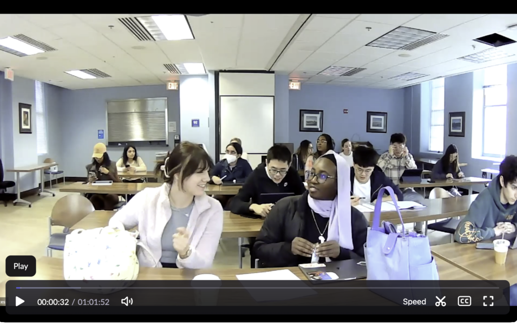 A video still of students sitting in a classroom in Fall 2022
