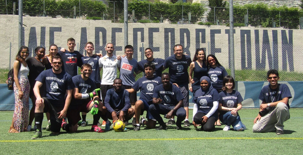 Participants pose on the soccer field at the 2018 Soccer Match and Barbecue