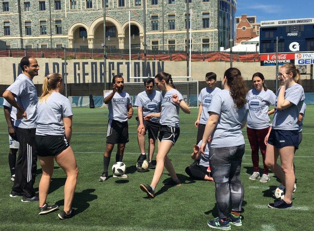 Participants on the soccer field at the 2019 Soccer Match and Barbecue