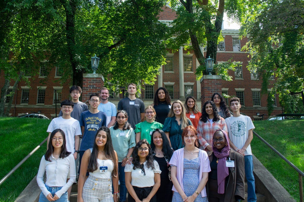 Students pose together outside of the Medical and Dental Building in Fall 2022