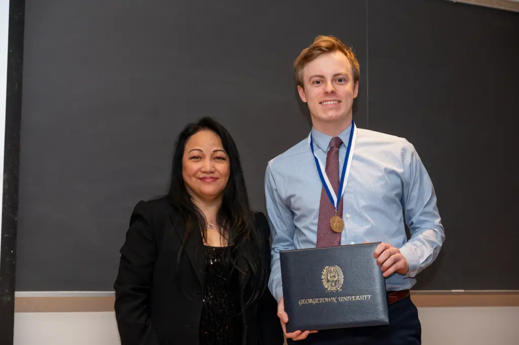 A student poses with Dr. Simbulan-Rosenthal at the Spring 2023 Tropaia Ceremony