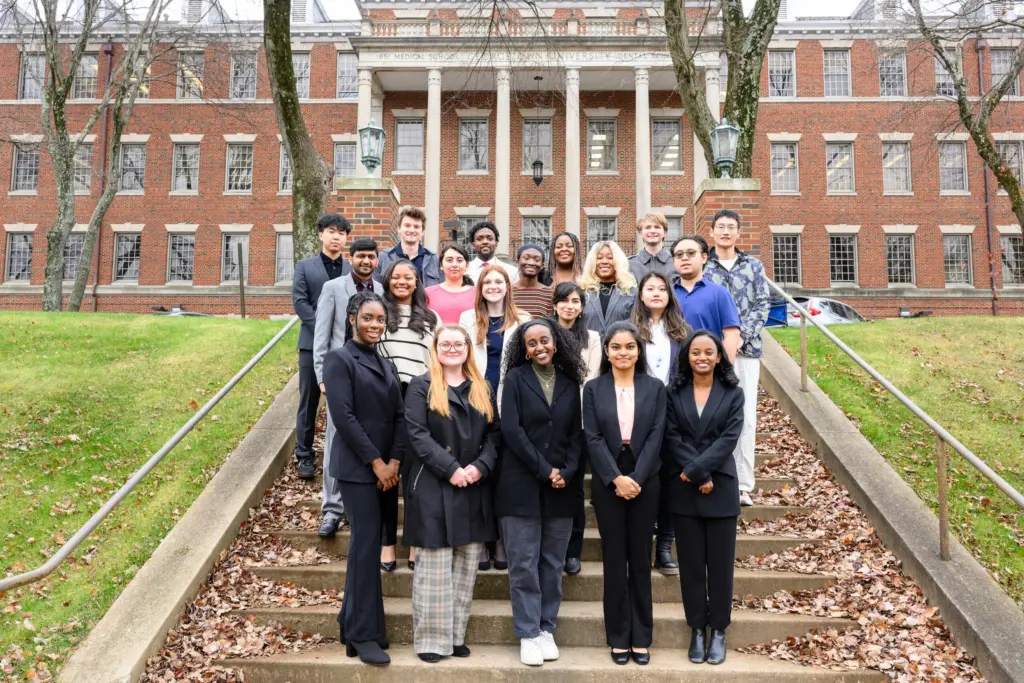 Students pose together outside the Medical and Dental Building during the Fall 2023 internship presentations